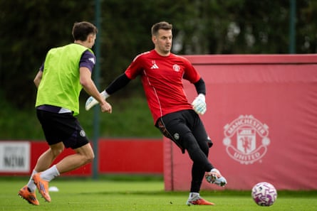 Tom Heaton moves the ball during a training session at Carrington