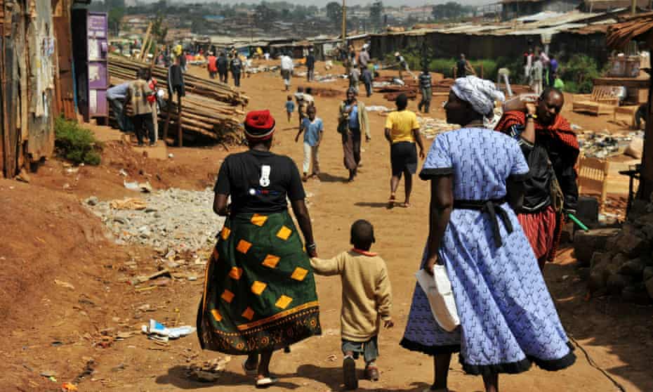 Two women and a child in Kibera.