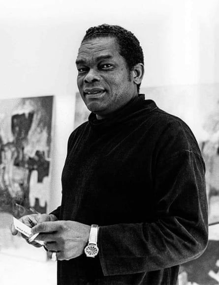 Williams in studio or gallery looking at camera