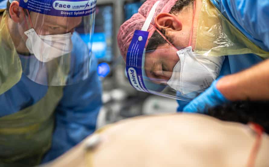 Anaesthetist checks patient’s breathing tube