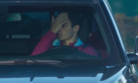 Mikel Arteta covers his face as he arrives at Manchester City training on Monday.