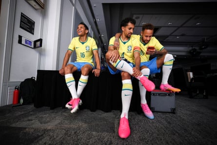 Neymar Jr, Marquinhos and Douglas Santos wait on the sidelines of the shoot.