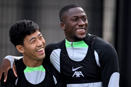 Ibrahima Konaté embracing Wataru Endo during a training session on Thursday.