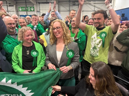 The Scottish Green party MSP Lorna Slater (centre) celebrates winning the Edinburgh Central constituency with supporters wearing green