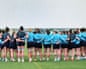 Scotland players gather into a huddle at the start of a training session this week