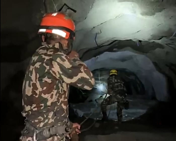 Nepal rescuers race to reach hundreds feared trapped in hydropower tunnels