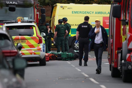 Police officers work at the scene following an incident outside a synagogue, in Manchester.