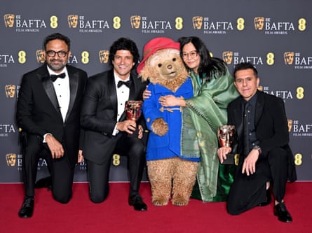 Boong makers Lakshmipriya Devi, Ritesh Sidhwani, Alan McAlex and Farhan Akhtar pose with Paddington. The film beat the likes of Lilo and Stitch and Zootropolis 2 to win best animation.
