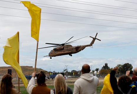 A helicopter transports Israeli hostages who were released on Saturday, in Reim, Israel.