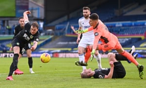 Burnley’s Ashley Barnes shoots but only after Ben Mee was ruled by the referee to have fouled Illan Meslier, the Leeds goalkeeper