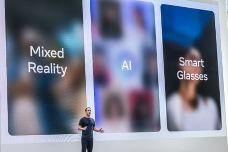 a man speaks in front of a screen that says "mixed reality" "AI" and "smart glasses"