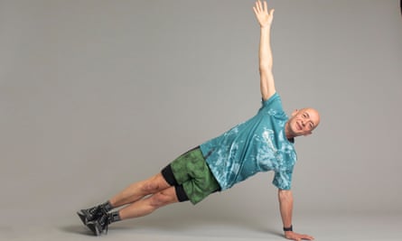 Phil Daoust holding a side plank position