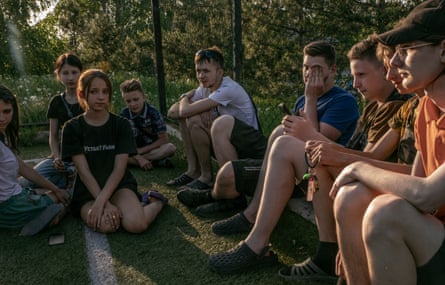 Daria Karpinska, 14, in black T-shirt with her classmates in the village of Hrodivka.