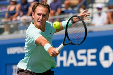 Sebastian Korda with a backhand to Cameron Norrie.