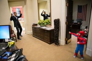 The president pretends to be caught in Spider-Man’s web as 3-year-old Nicholas Tamarin catches him outside the Oval Office