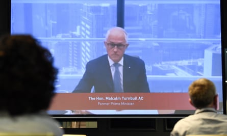 Malcolm Turnbull appears on a large screen
