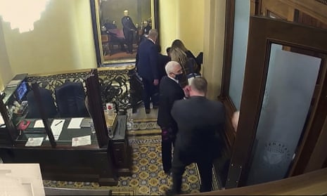 Vice-President Mike Pence is captured on security video being evacuated as rioters breach the Capitol on 6 January 2021.
