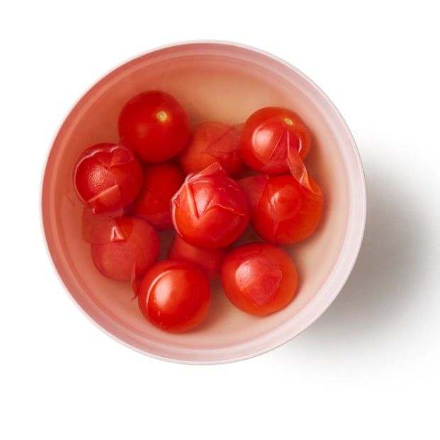 Put the tomatoes in a heatproof bowl, cover with boiling water and leave to sit for a minute, until the skins begin to split. Drain, peel and discard the skins