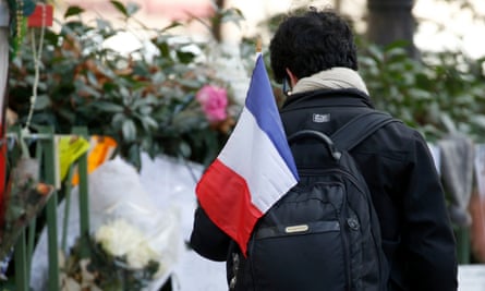 A man with a tricolore outside the Bataclan concert hall in Paris.