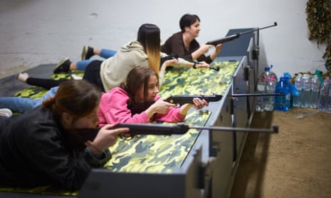 Women practise with rifles in the basement of Litsey 20, one of the largest schools in Ivano-Frankivsk.