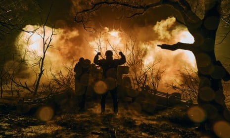 Ukrainian soldiers fire artillery at Russian positions near Bakhmut, Donetsk region.