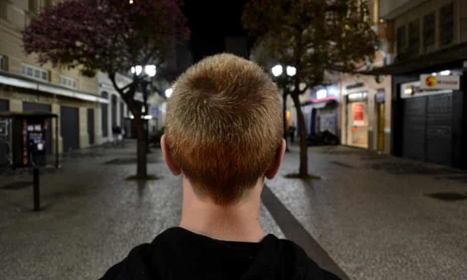 Boy standing on street