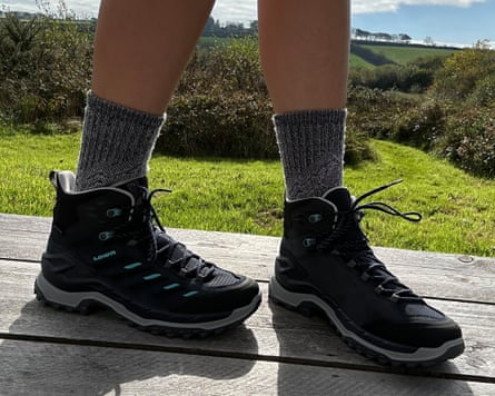 The writer’s feet wearing the Lowa Innovo GTX mid on some decking in the countryside