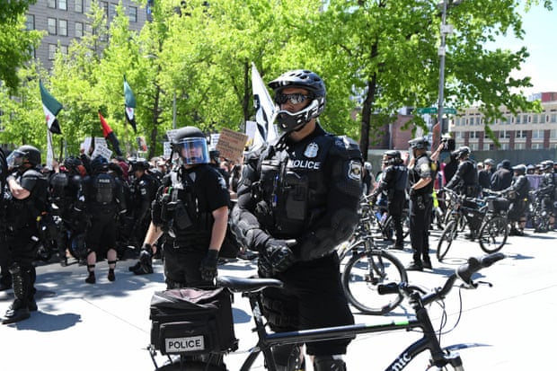 Riot police using bikes in downtown Seattle at the anti-sharia rally last sunday, 11th June 2017