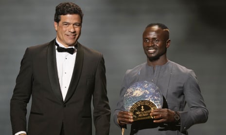Rai, the younger brother of Socrates, presents The Socrates Award to winner Bayern Munich’s Sadio Mane in October. Not the same Socrates I studied at Duke. I think. I didn’t do very well.