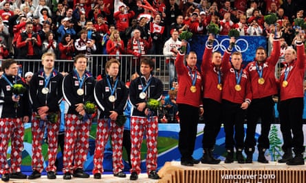 Canada’s gold winning team along with silver medalist Norway celebrate on the podium during the Vancouver Winter Olympics