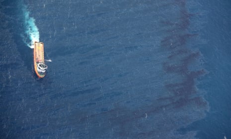 China’s offshore supply ship De Shen working at an oil spill area during a clean-up operation at sea off the coast of eastern China.