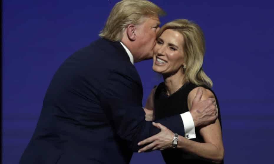 Donald Trump gives Laura Ingraham a kiss after inviting her on stage during the Turning Point USA student action summit in West Palm Beach, Florida, on December 2019.