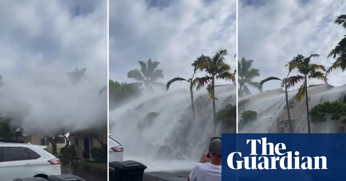 ‘Historic’ waves crash over two-storey buildings in Hawaii – video