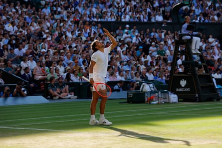 Flavio Cobolli looks skywards during his quarter-final against Novak Djokovic
