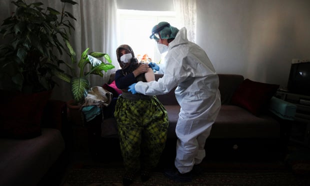 A 76-year old woman receives the second dose of Sinovac Covid-19 vaccine at her home in Deliler village, near Elmadağ, Ankara province.