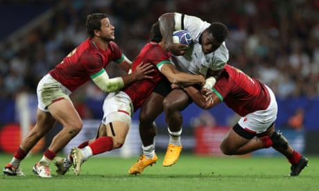 Josua Tuisova, shown being tackled by Portugal, has stayed in France with the Fijian team as he grieves for his son, Tito, who died in September.