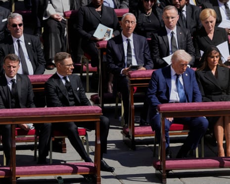 President Donald Trump, third from right, flanked by first lady Melania Trump, French President Emmanuel Macron, front row left, and Finland's President Alexander Stubb, second left, attend the funeral of Pope Francis in St. Peter's Square at the Vatican.
