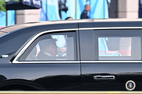 Donald Trump sits in his official vehicle known as "The Beast" as the motorcade drives through Beijing.