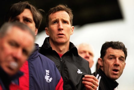 Joey Jones, centre, on the touchline during his post-playing career at Wrexham