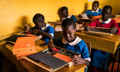 Members of code club start building their computers at a girls school in Kenya
