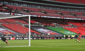 Fabinho of Liverpool scores in the penalty shootout.