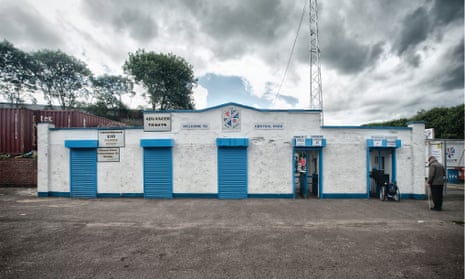 Central Park, home of Cowdenbeath FC. It is one hour before kick-off and the turnstiles have just opened for the new season.