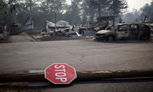 A stop sign is seen at a neighborhood destroyed by wildfires near Bear Creek, Phoenix, Oregon.