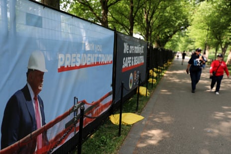 A Trump administration banner thanking Donald Trump covered fencing near the Lincoln Memorial Reflecting Pool on the National Mall on 24 April.