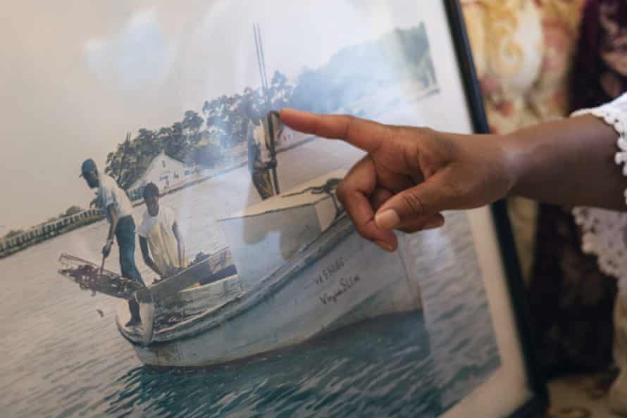 A painting of Black oystermen, including two relatives of Mary Hill, is on prominent display in her childhood home.