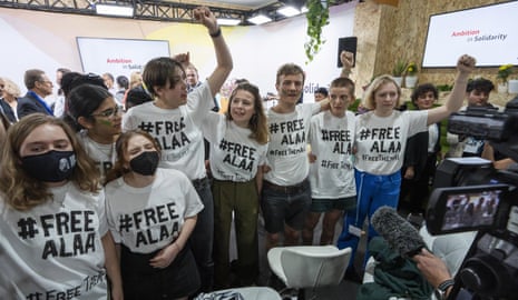 A group of protesters wear T-shirts with #FREEALAA at Cop27.