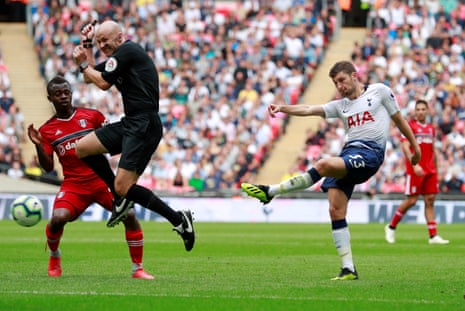 August 18: Referee Anthony Taylor attempts to get out of the way as Tottenham’s Ben Davies shoots at goal against Fulham.