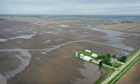 Farmers across the midwest have been losing money for years as climate crisis floods fields and trade wars brought soybeans to below break-even values.
