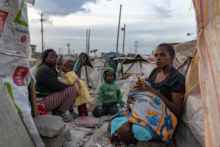 A family in a makeshift displacement camp that has sprung up on the demolition site in Mukuru Kwa Njenga