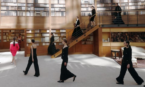 Models wear Chanel’s autumn winter 2019-20 haute couture collection on a set designed to look like a library.